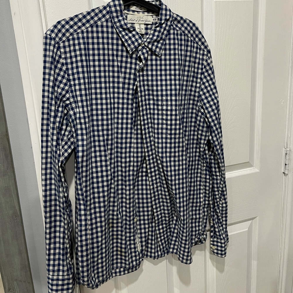 H&M long sleeve button down shirt. Large in size. White and blue color